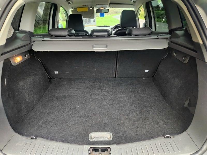 The boot of a silver Ford Kuga 2.0 TDCi Titanium, viewed from behind.