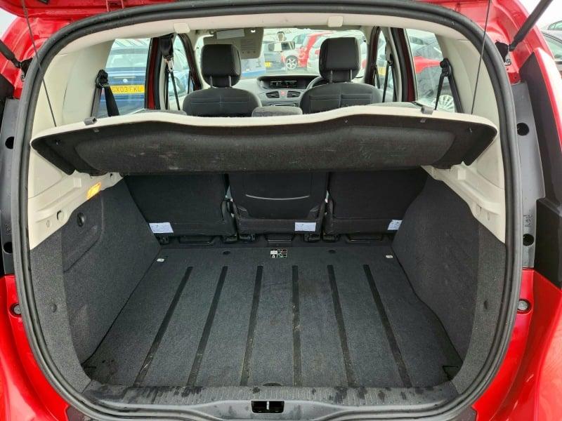 The boot of a red Renault Scenic 1.4 TCE Expression, viewed from behind.