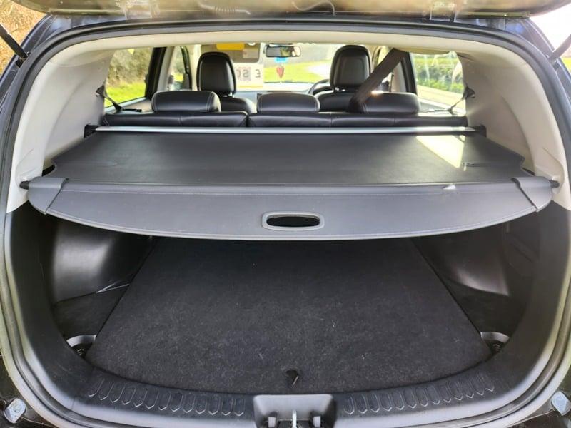 The boot of a black Kia Sportage 2.0, viewed from behind.