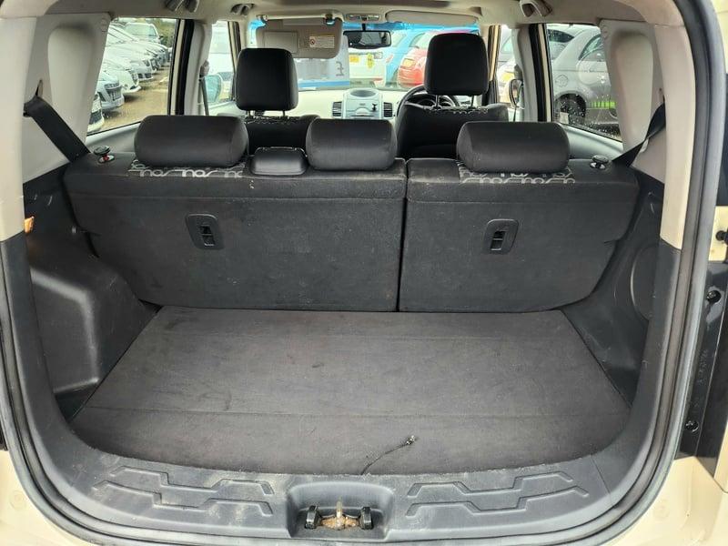 The boot of a white Kia Soul MPV, viewed from behind.