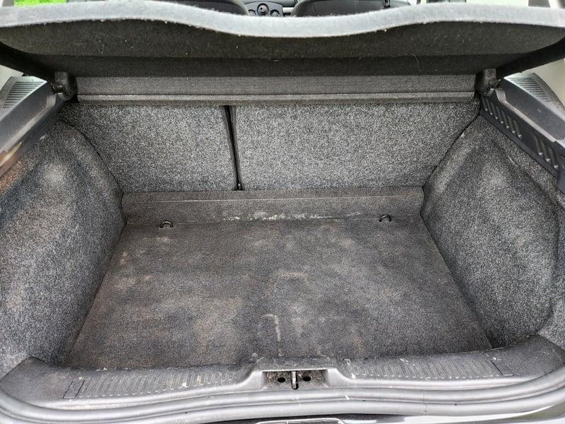 The boot of a Jet Black Metallic Renault Clio Dynamique, viewed from behind.