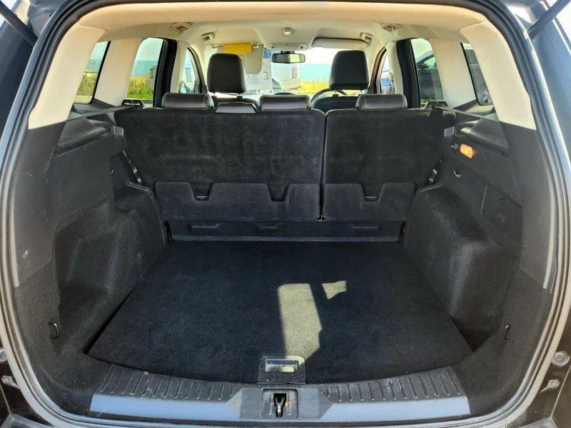 The boot of a black Ford Kuga 2.0 TDCi Titanium, viewed from behind.