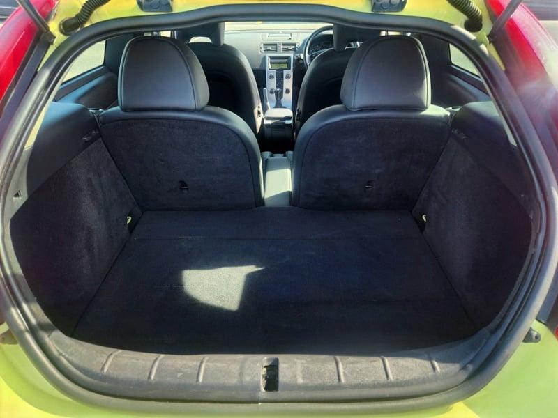 The boot of a Lime Yellow Volvo C30 SE LUX, viewed from behind.