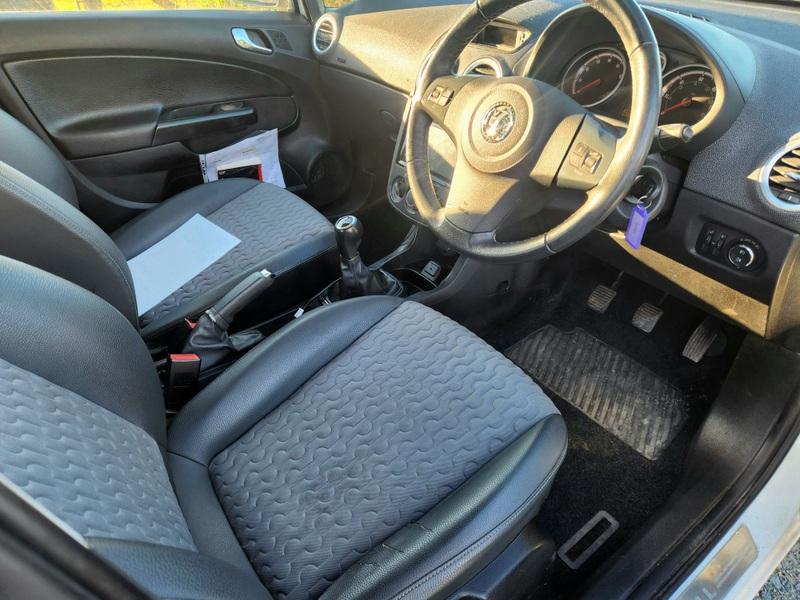 A white Vauxhall Corsa 1.4 SE viewed from the driver seat
