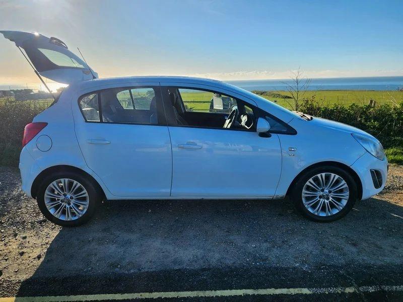 A white Vauxhall Corsa viewed from the drivers side
