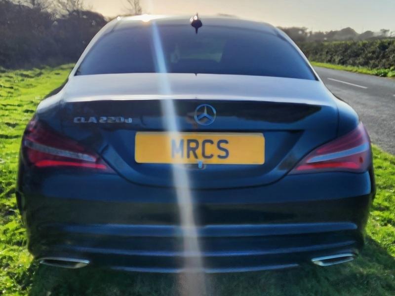 A black Mercedes viewed from behind