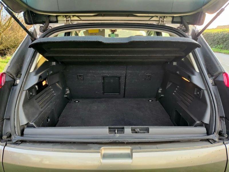 The boot of a grey Peugeot 3008 viewed from behind