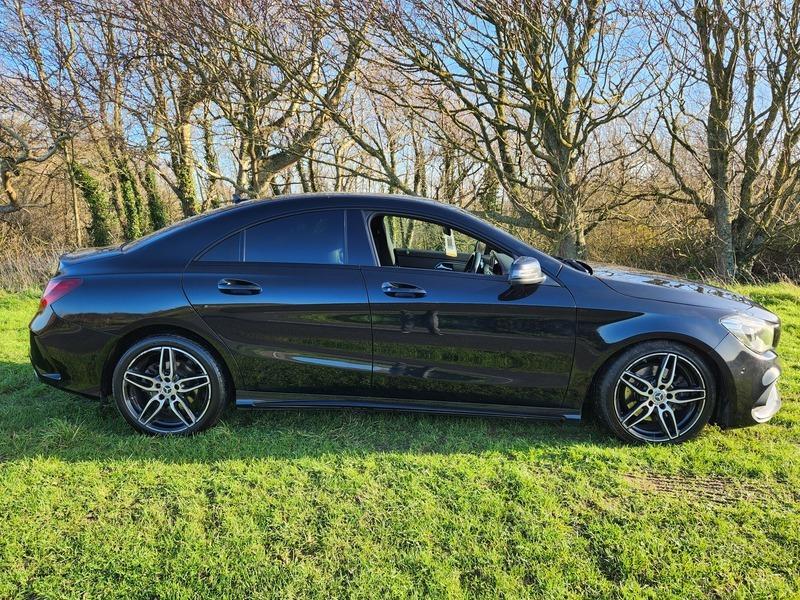 A black Mercedes viewed from the driver side