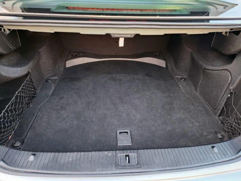 The boot of a silver Mercedes viewed from behind