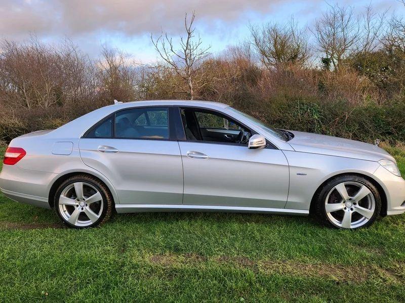 A silver Mercedes viewed from the driver side