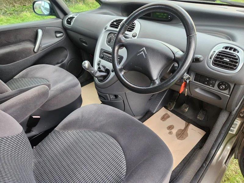 The steering wheel and controls of a Citroen Picasso viewed from the driver's side