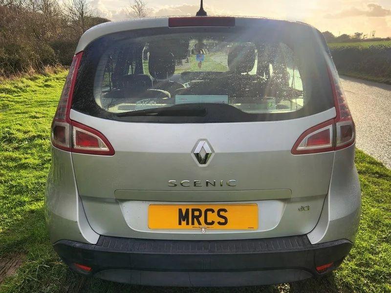 A silver Renault Scenic viewed from behind