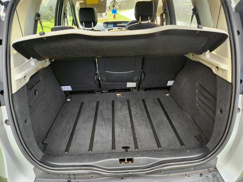 The boot of a silver Renault Scenic viewed from behind