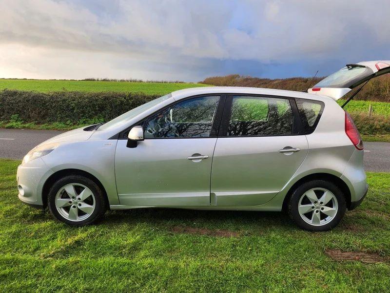 A silver Renault Scenic viewed from the passenger side
