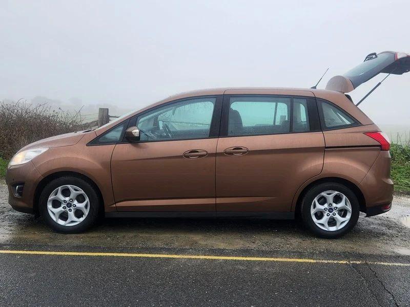 A brown Ford C Max viewed from the passenger side