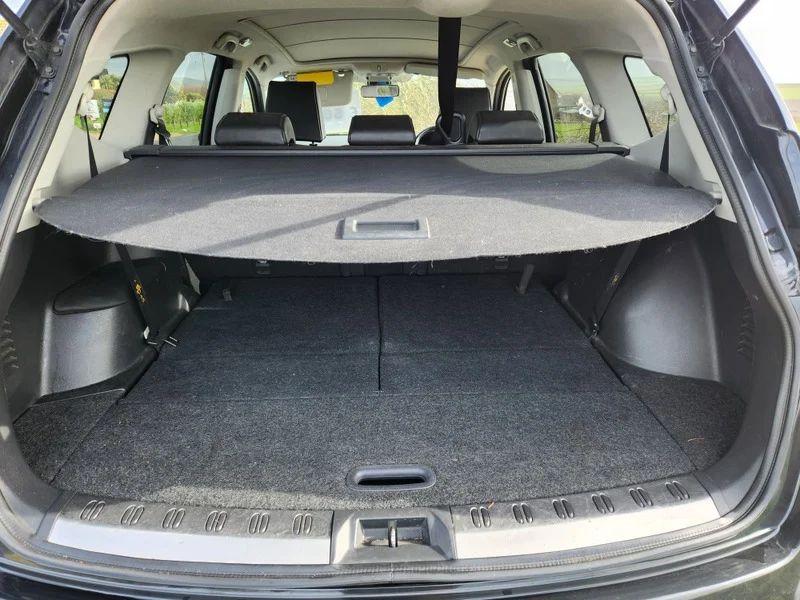The boot of a black Nissan Qashqai viewed from behind the car