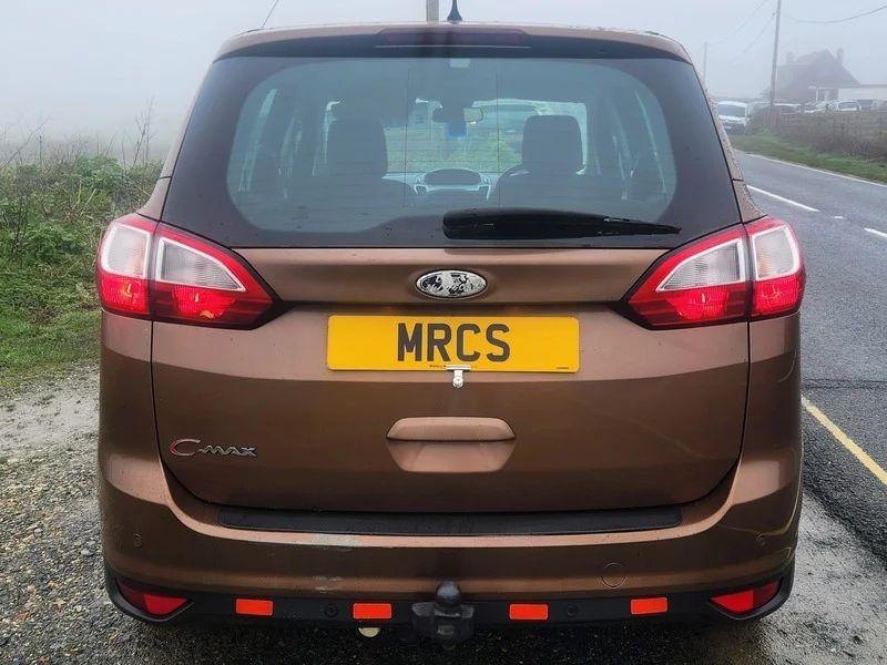 A brown Ford C Max viewed from behind