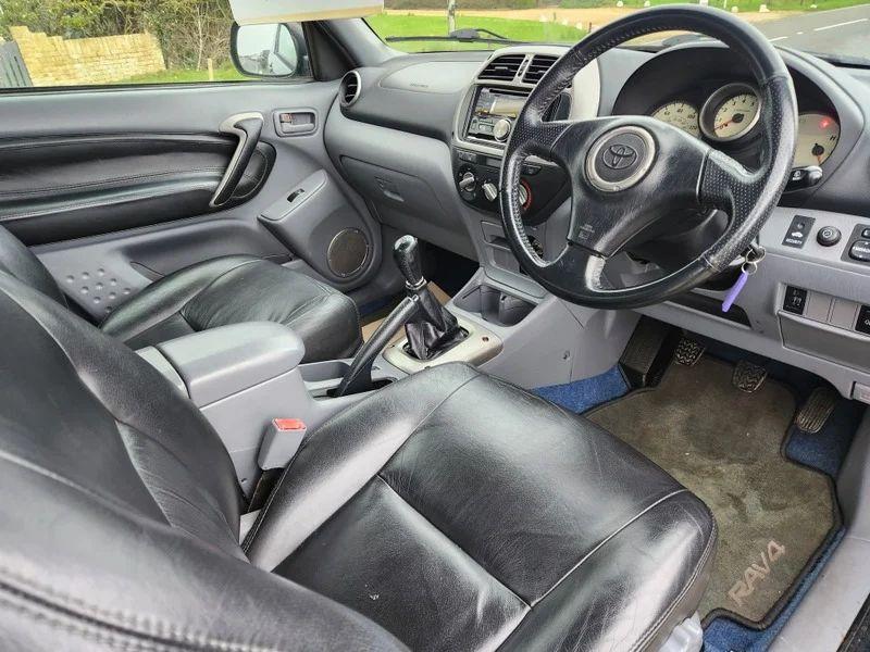 The steering controls of a Toyota RAV4 viewed from above the driver seat