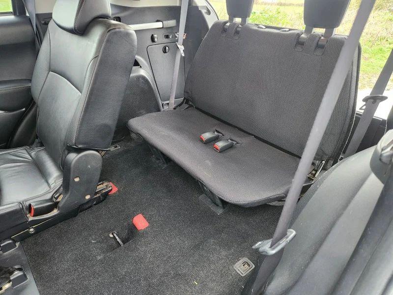 The interior space of a silver Citroen C-Crosser viewed back from the passenger window