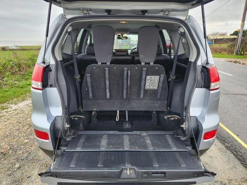 The open boot of a Citroen C-Crosser, with the tailgate down, viewed from the back