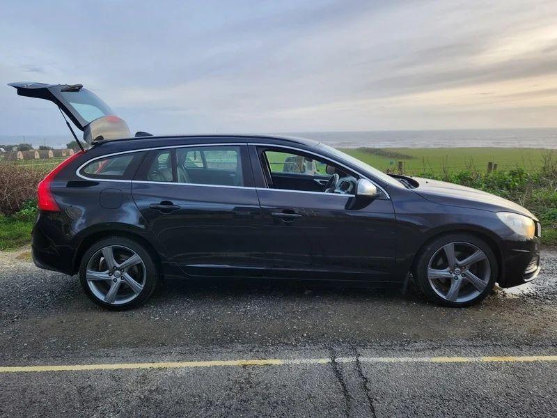 A black Volvo V60 Estate viewed from the driver side