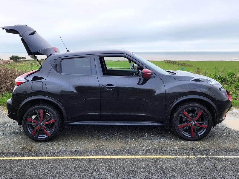 A black Nissan Qashqai viewed from the driver side