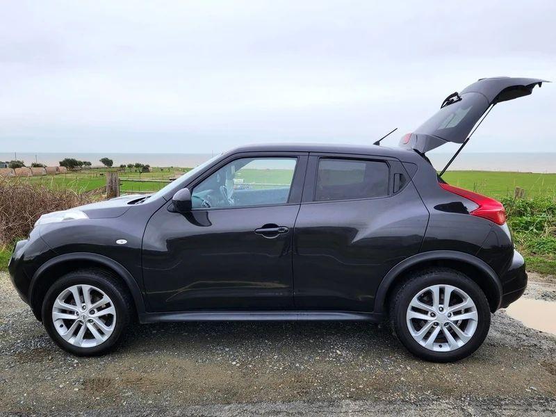 A black Nissan Juke viewed from the passenger side