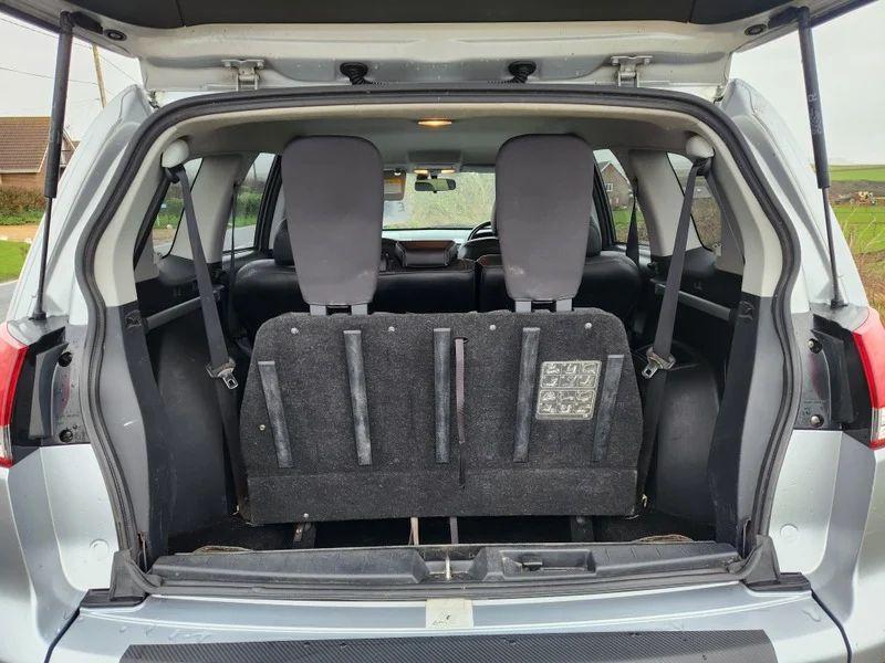 The open boot of a Citroen C-Crosser viewed from the back