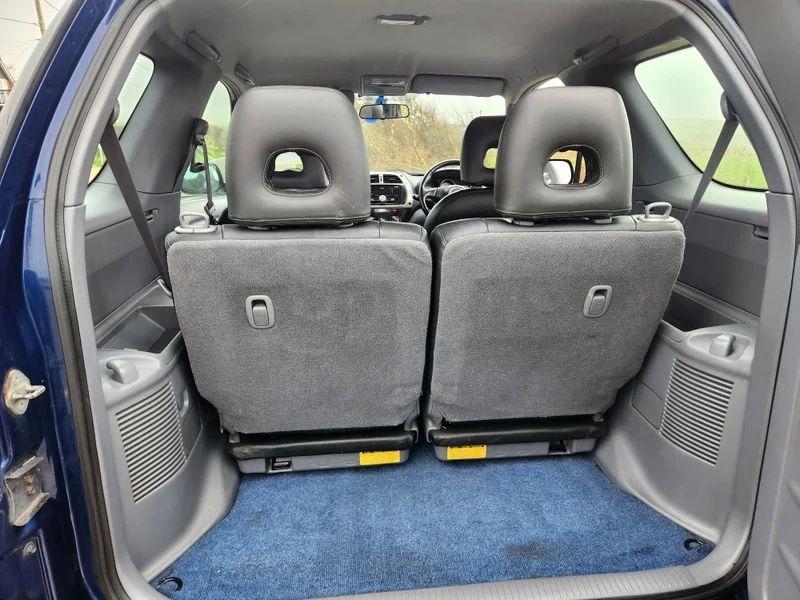 The open boot of a Toyota FAV4 viewed from the back