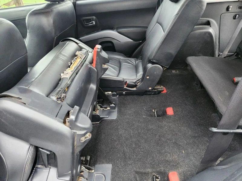 The interior of a Citroen C-Crosser viewed from the rear passenger side window