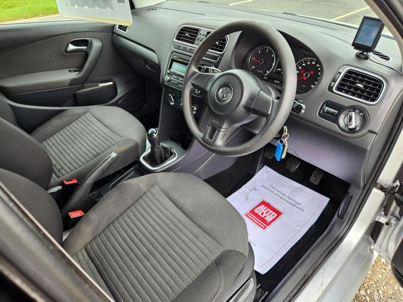 The steering controls of a silver Volkswagen Polo Match viewed from above the driver seat