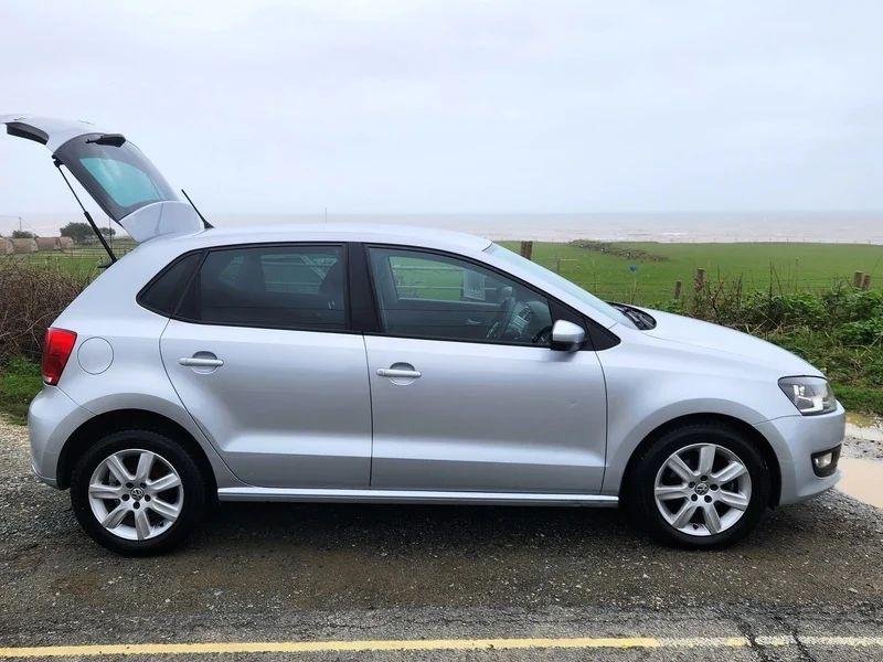A silver Volkswagen Polo Match viewed from the driver side