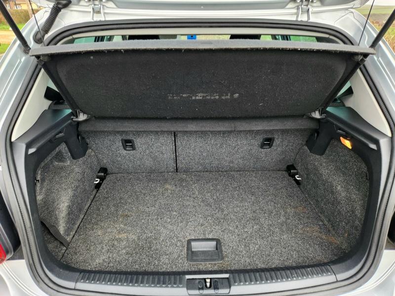 The open boot of a silver Volkswagen Polo Match viewed from the back