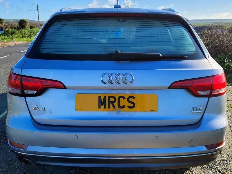 A silver Audi A4 Sport viewed from the back