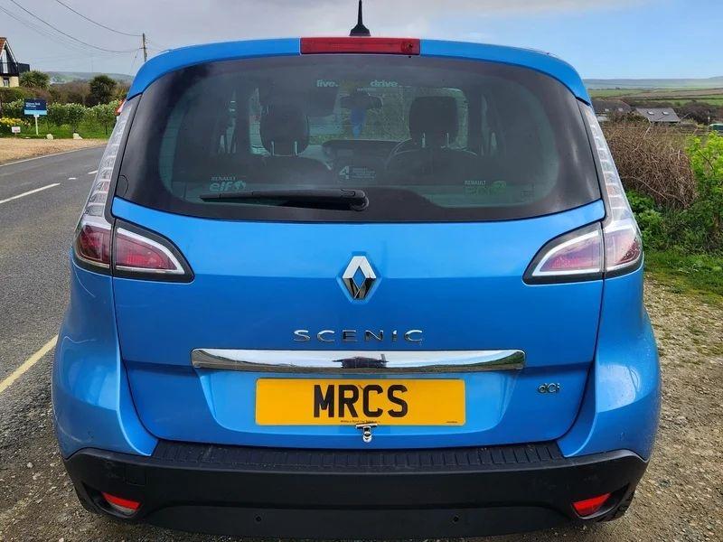 A blue Renault Scenic viewed from the back