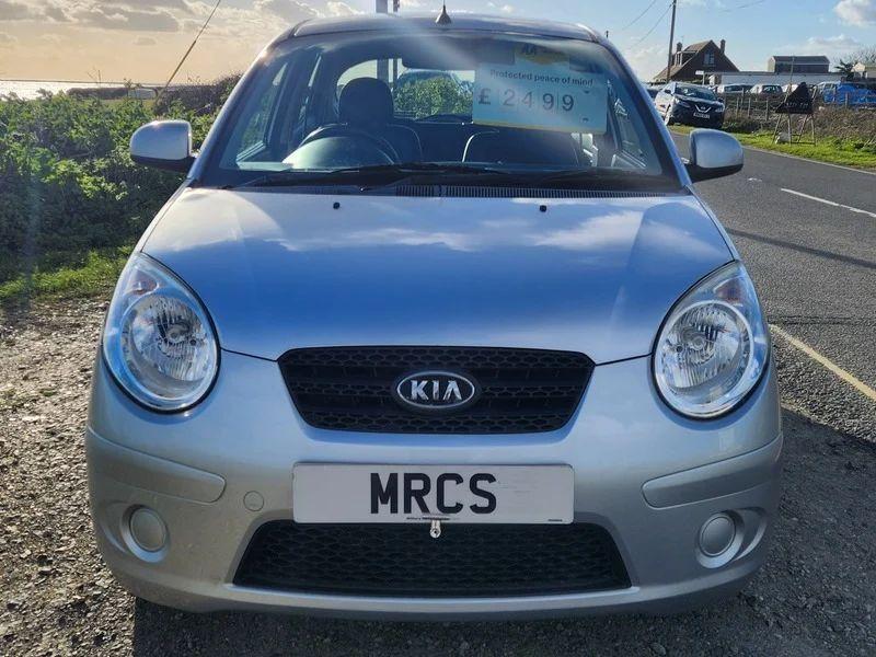 A sparkling silver metallic Kia Picanto viewed from the front