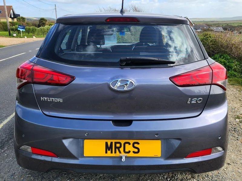 A Mystic Blue Metallic Hyundai i20 viewed from the back