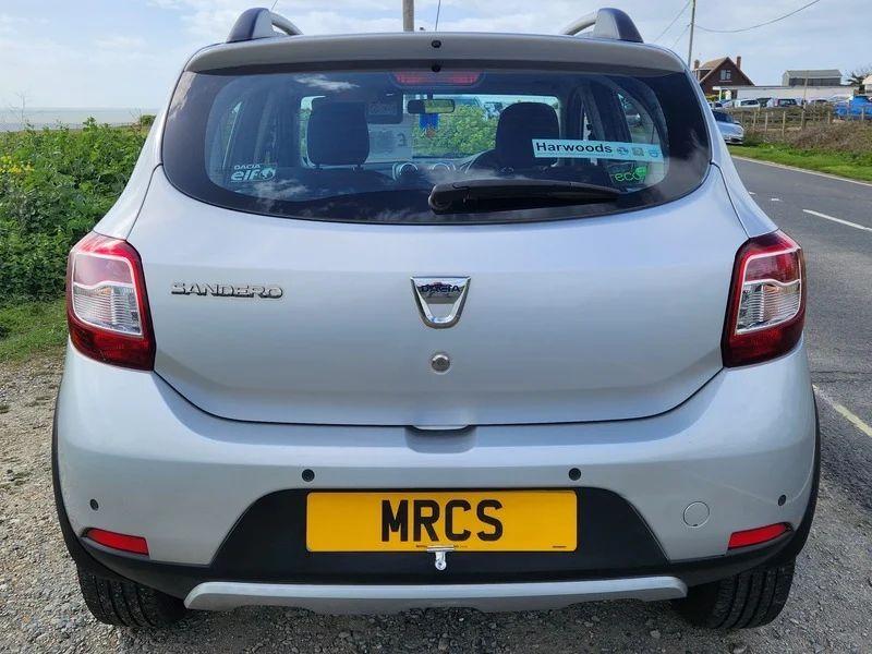 A Platinum Silver Metallic Dacia Sandero Stepway viewed from the back