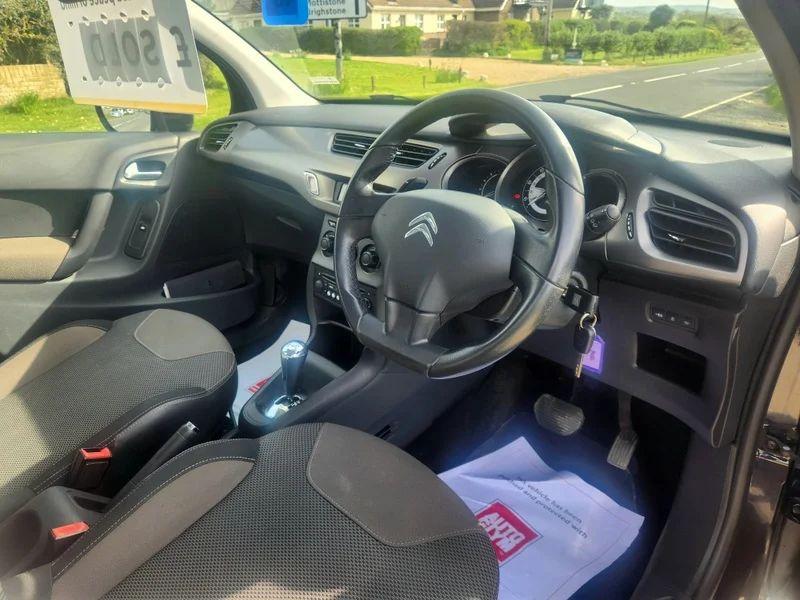 The steering controls of a Citroen C3 in Midnight Blue Metallic, viewed from above the driver seat.