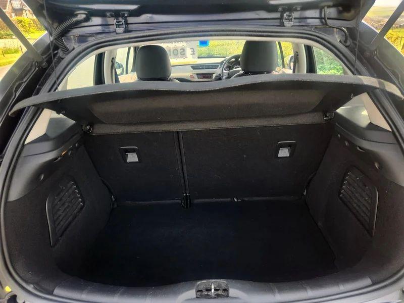 The open boot of a Citroen C3 in Midnight Blue Metallic, viewed from the back.