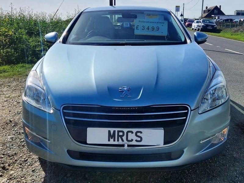 A Peugeot 508 Allure in Twilight Blue Metallic, viewed from the front.