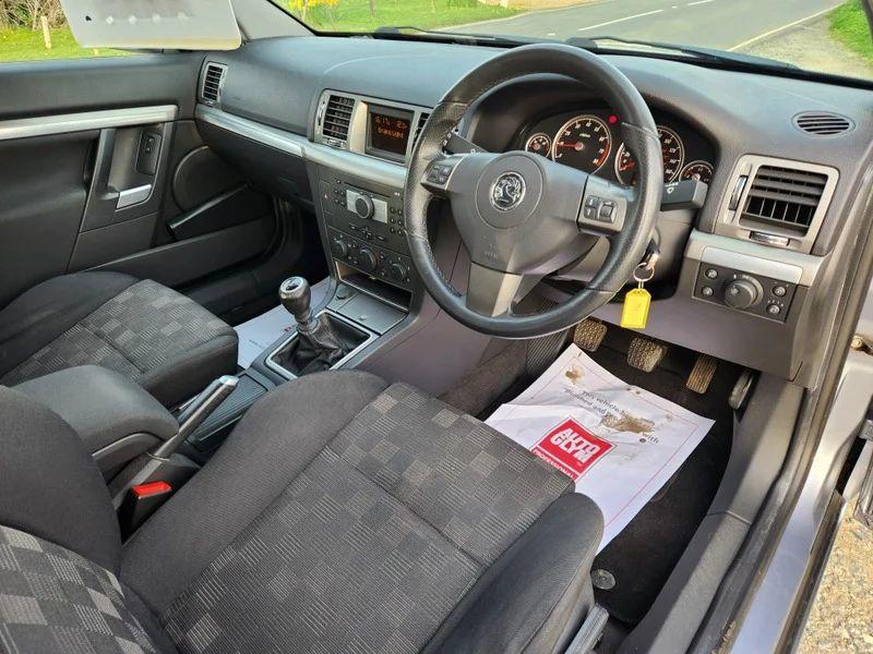 The steering controls of a Vauxhall Vectra in Ultra Blue Metallic, viewed from above the driver seat.