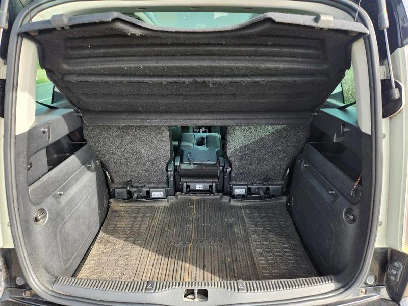 The open boot of a Skoda Roomster in Jet Black Metallic, viewed from the back.