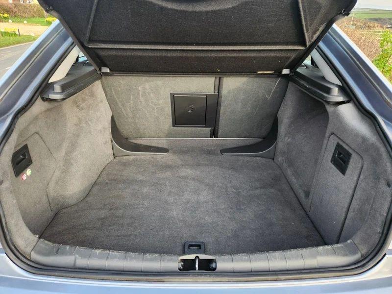 The open boot of a Vauxhall Vectra in Ultra Blue Metallic, viewed from the back.