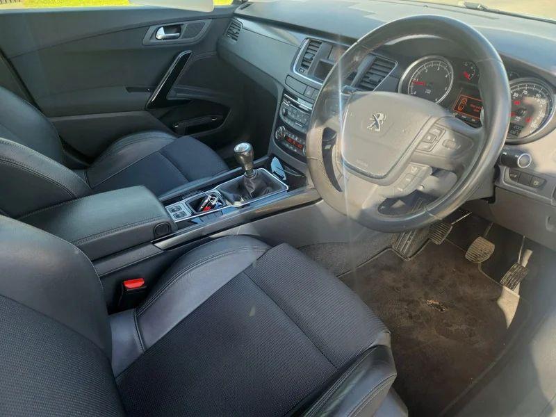 The steering controls of a Peugeot 508 Allure viewed from above the driver seat