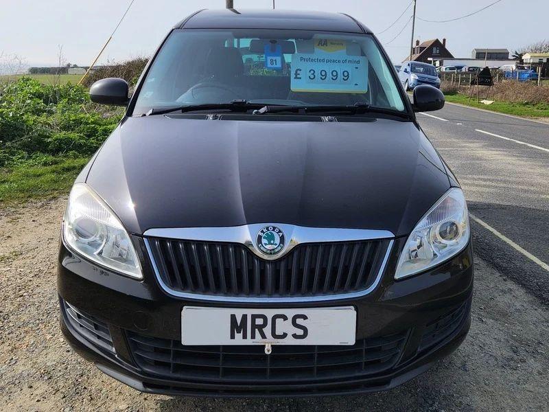 A Skoda Roomster in Jet Black Metallic viewed from the front
