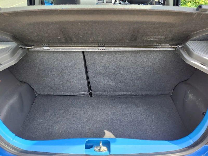 The open boot of a blue Chevrolet viewed from the back