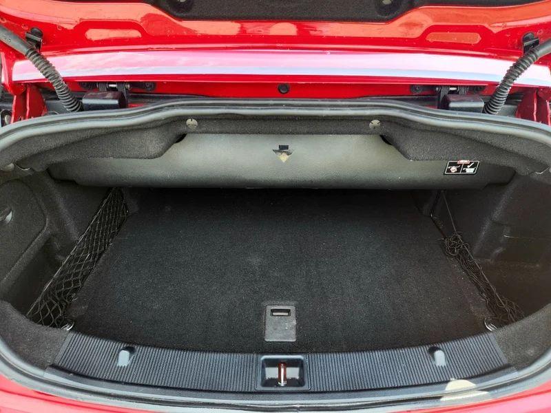 The open boot of a red Mercedes viewed from the back