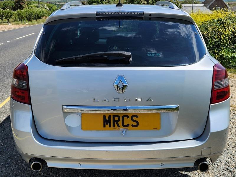 A silver Renault Laguna estate viewed from the back