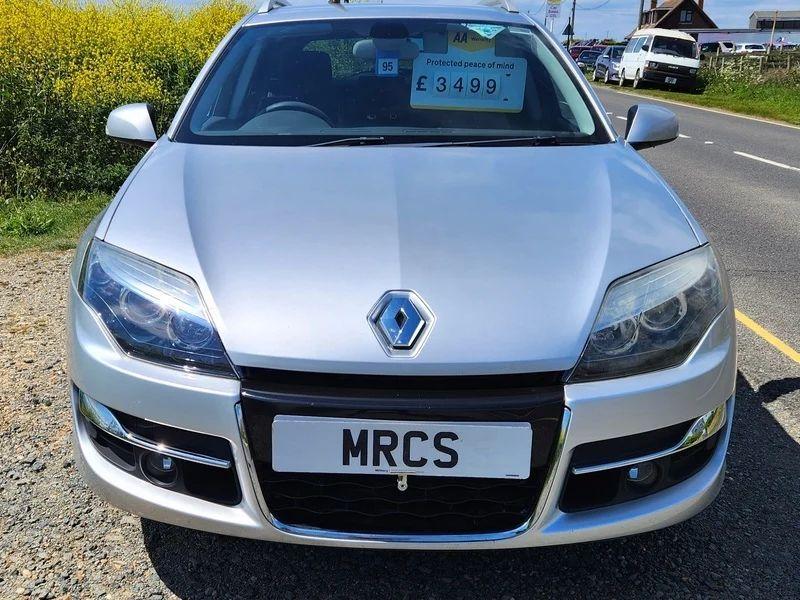 A silver Renault Laguna estate viewed from the front